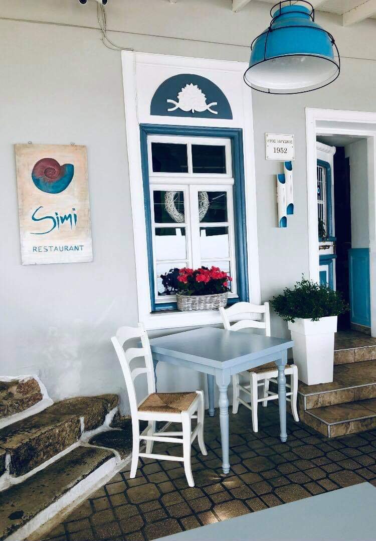 Entrance and outdoor table at Simi Restaurant in Limenas